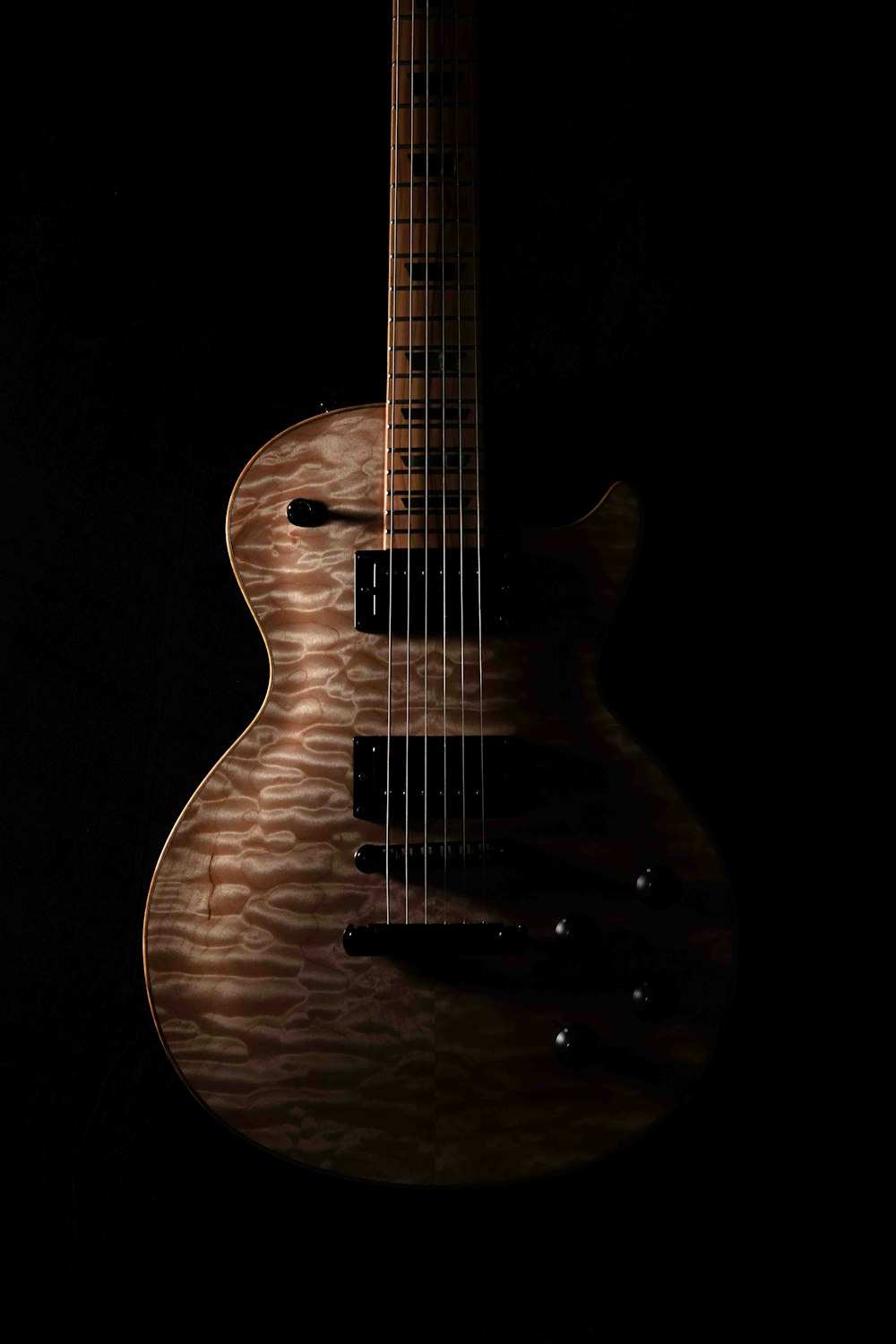 brown and black guitar