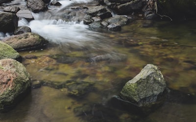 time-lapse photography of flowing waterfall