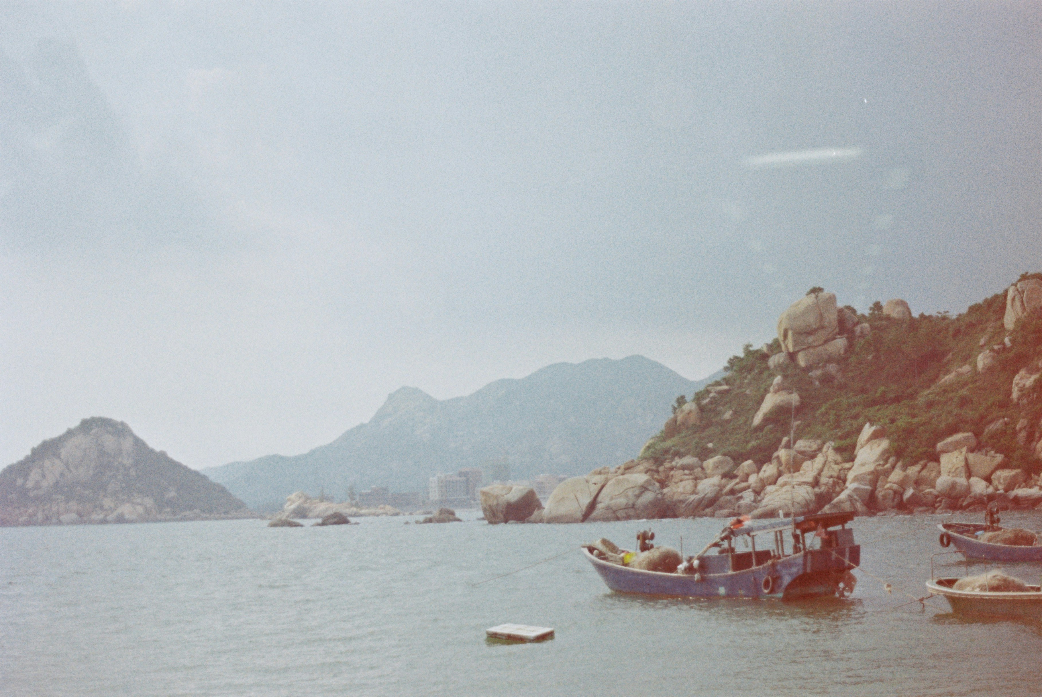 boats floating in the sea during daytime