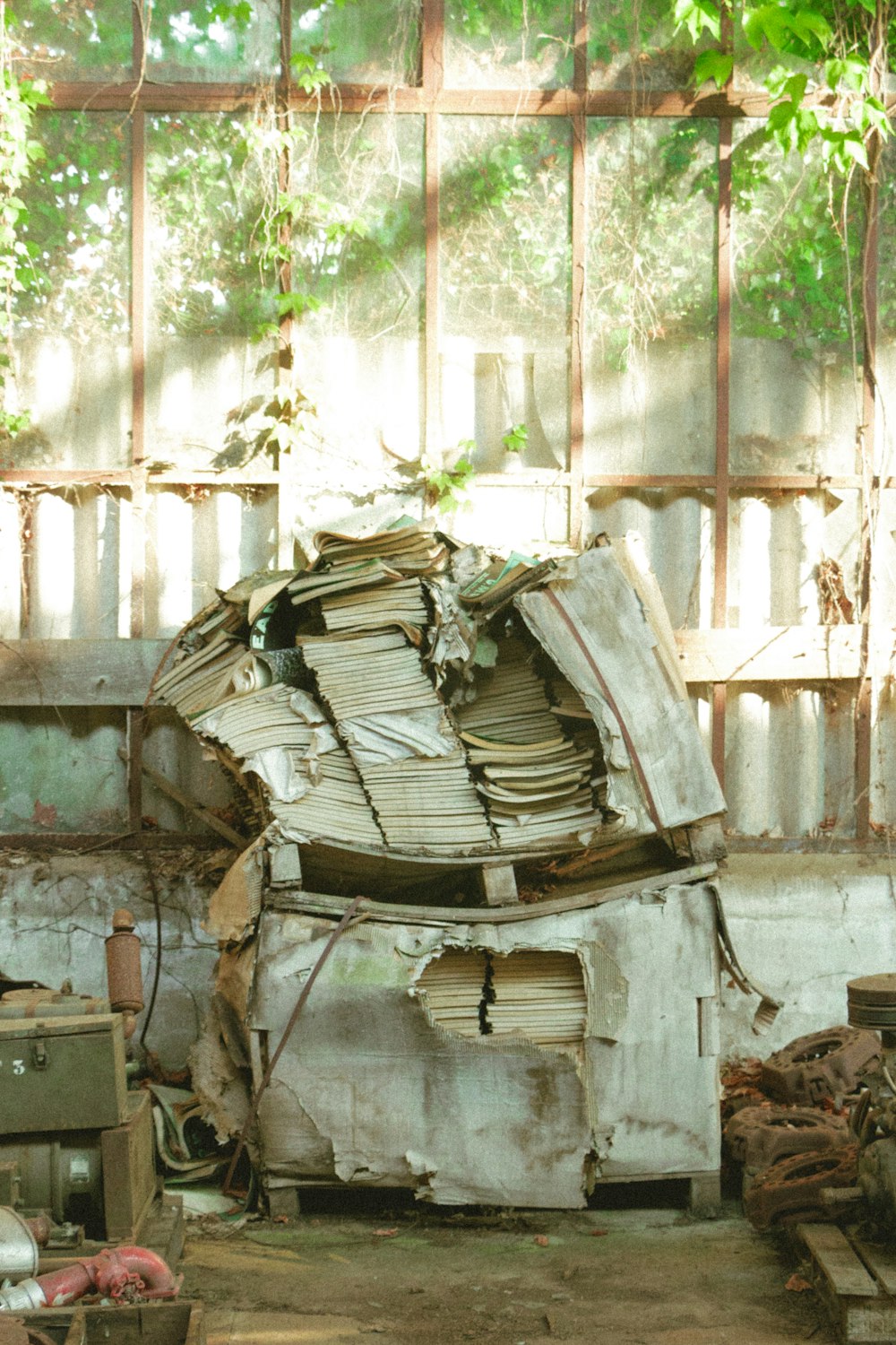 pile of books on top of a wooden table