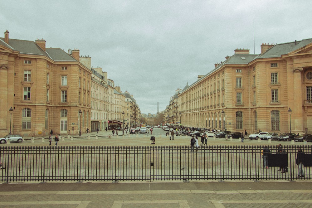 cars parked near brown building during daytime