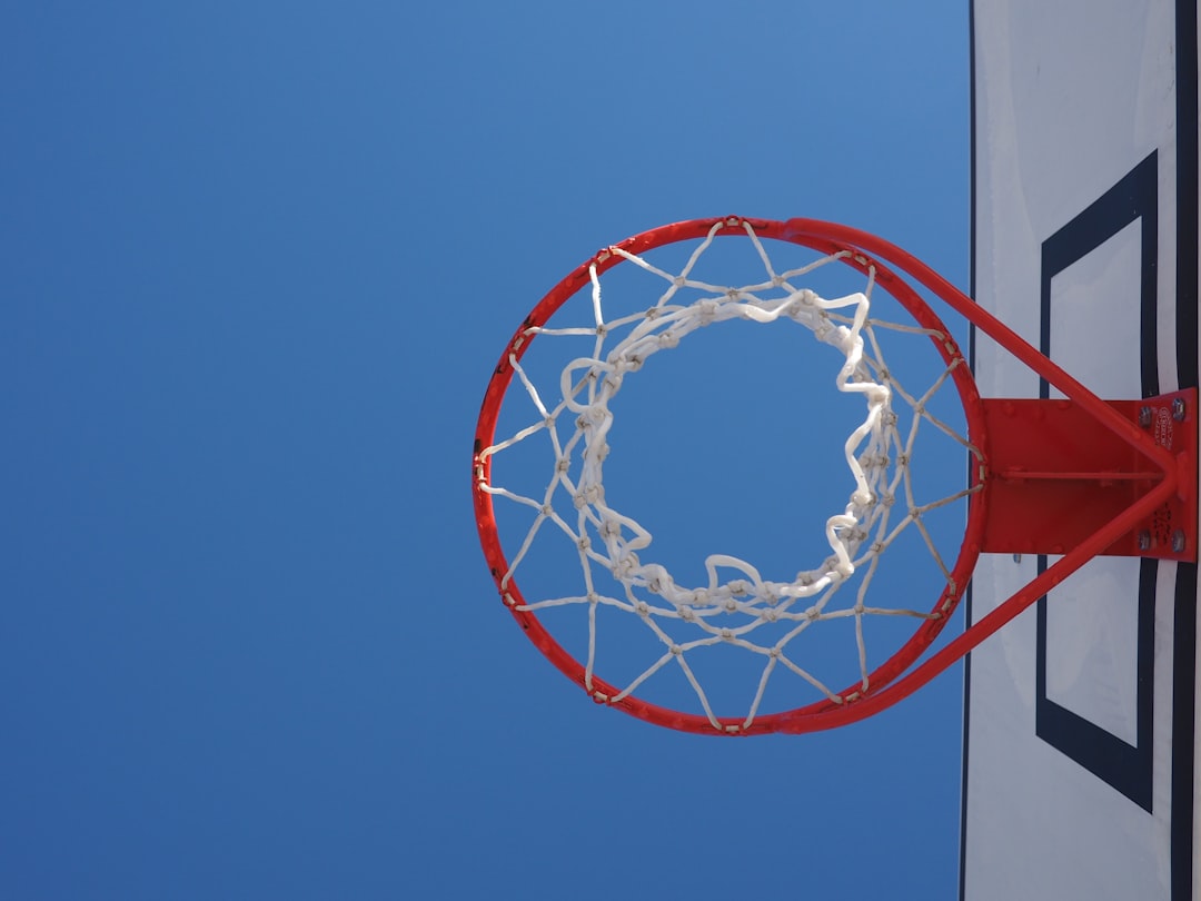 shallow focus photo of red basketball hoop