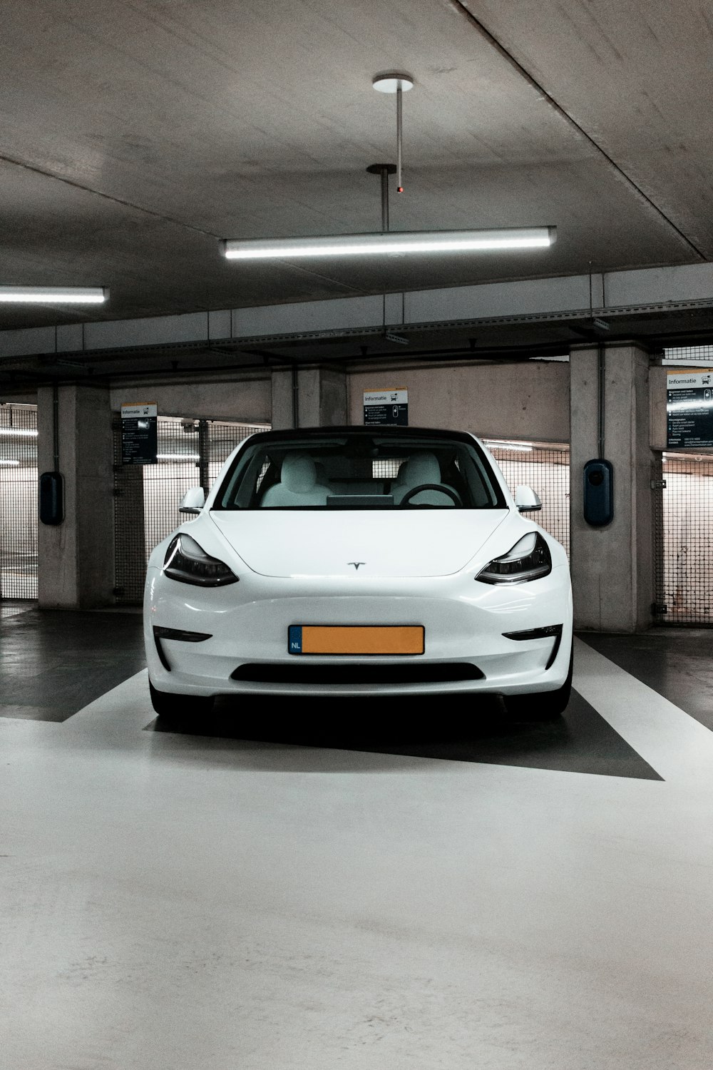 white McLaren 12C parking in garage area