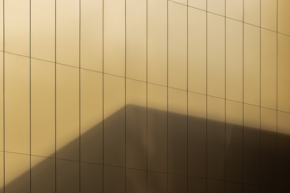 a shadow of a building on a wall