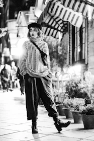 A serene street scene in Paris with a casually dressed figure wearing superfit paris sportwear, blending elegance with city life.