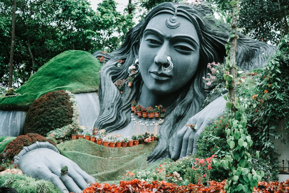 long-haired woman statue at garden