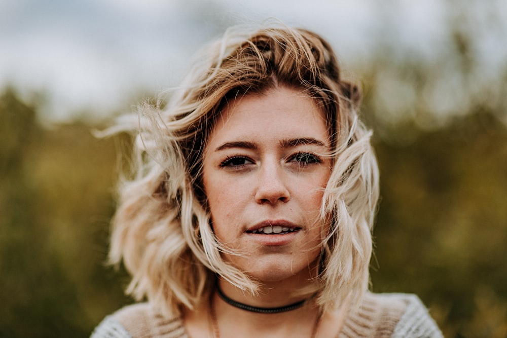 woman wearing black choker