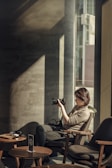 A behind-the-scenes shot of a video shoot at a cafe.
