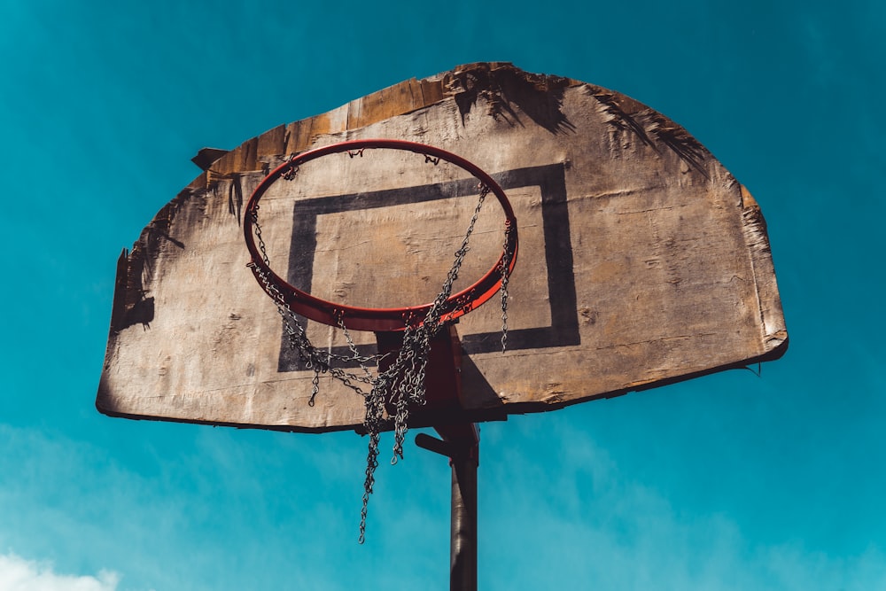 brown and black basketball hoop during day