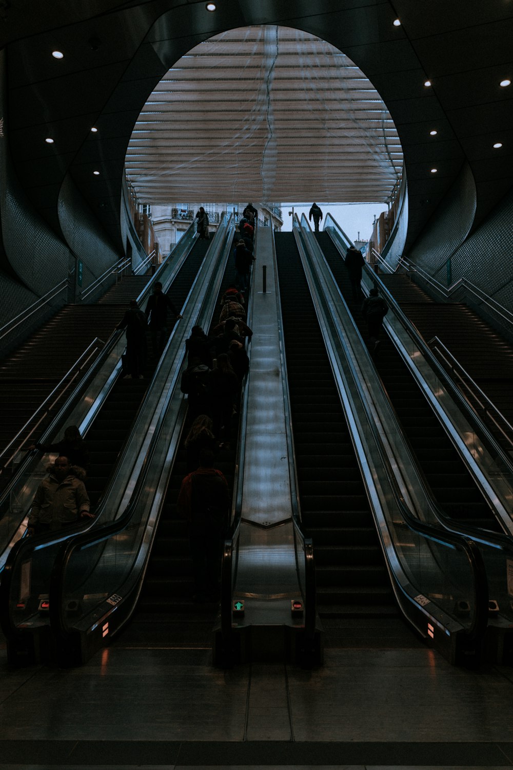 man standing on the escalator