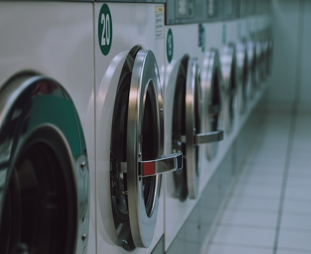 selective focus photography of inline front-load washers