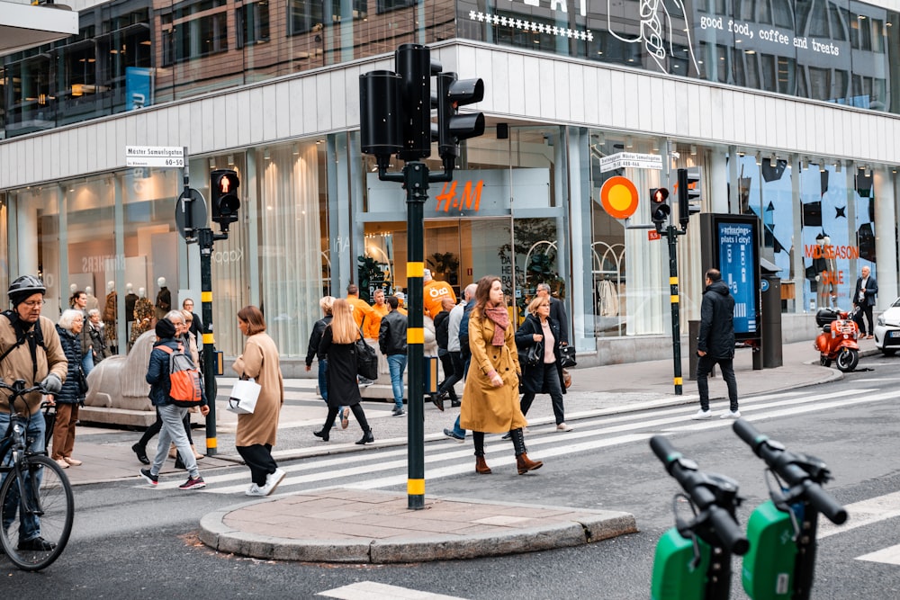 people walking in pedestrian lane