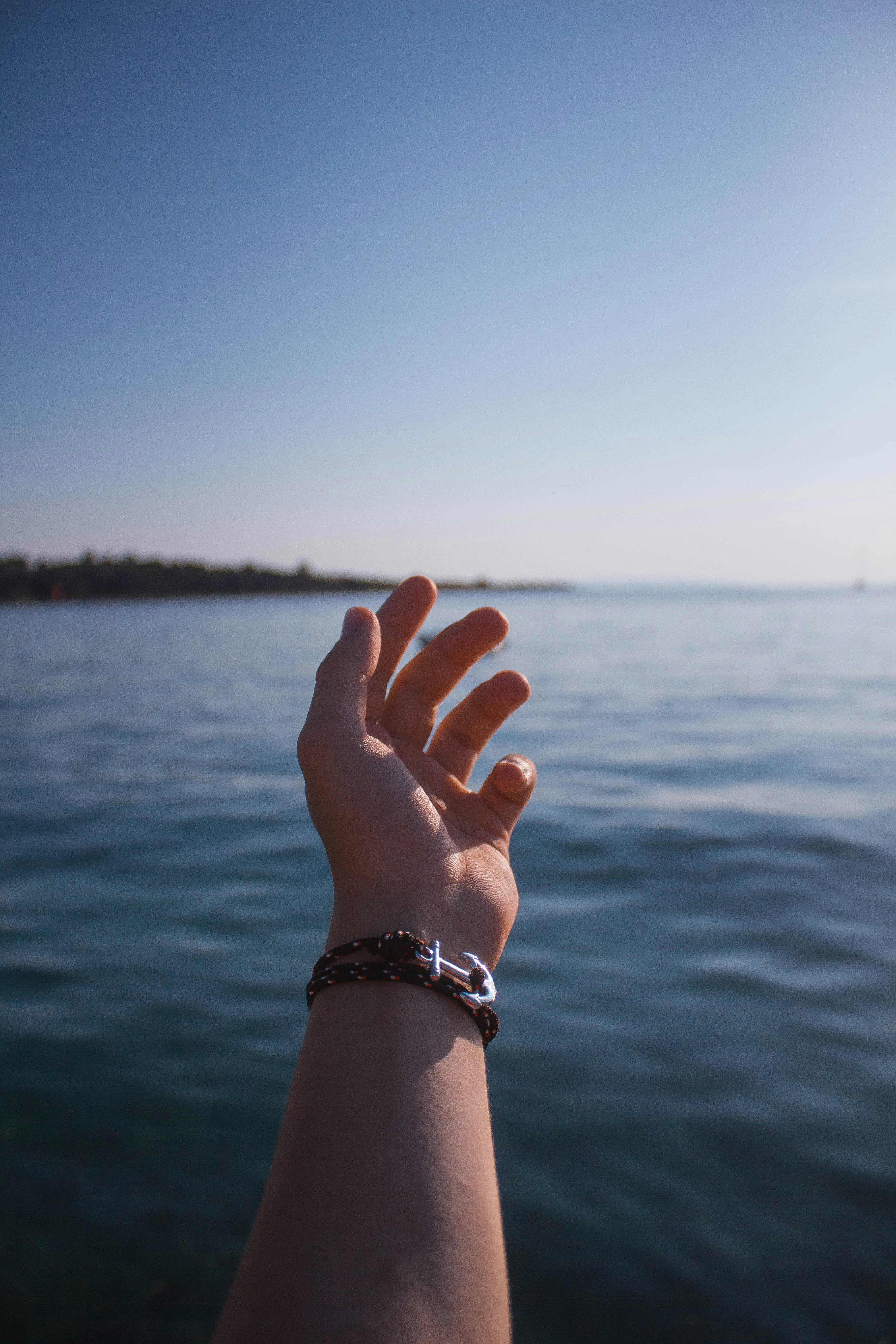 person wearing blue rope bracelet