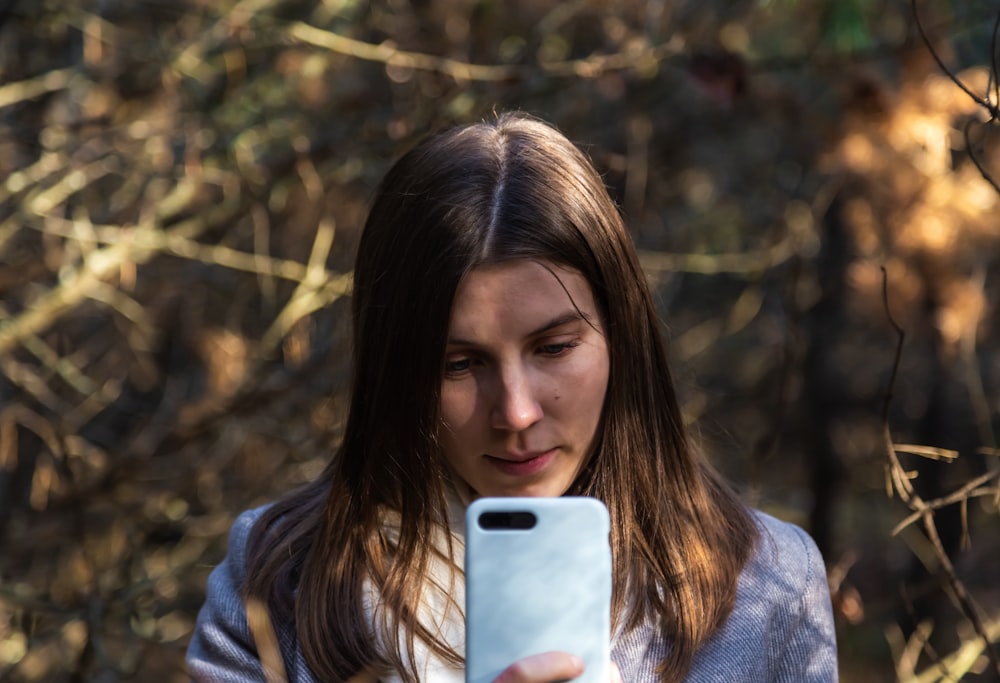 woman looking at her smartphone