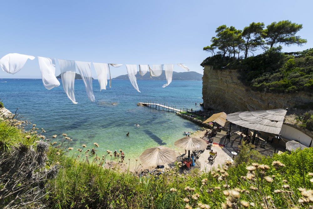 structures and people at the beach during day