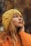 woman in yellow beanie hat and orange sweatshirt