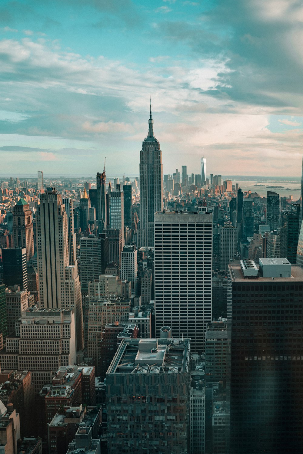 top view of cityscape under cloudy sky