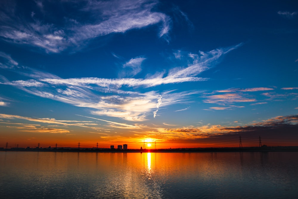 calm body of water during golden hour