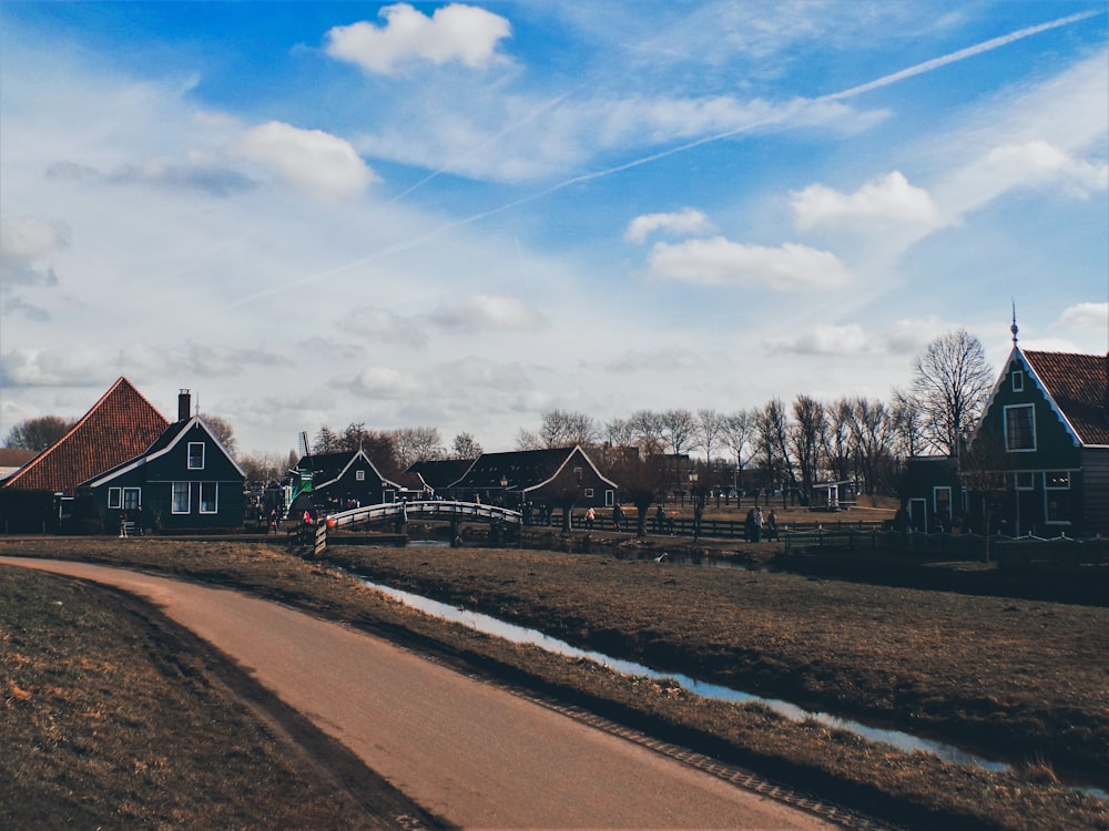 black-and-brown houses under blue cloudy sky