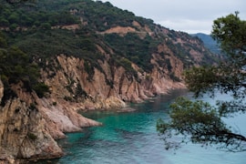 mountains near body of water