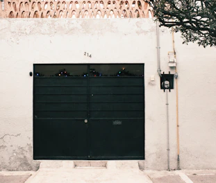 shallow focus photo of black steel gate