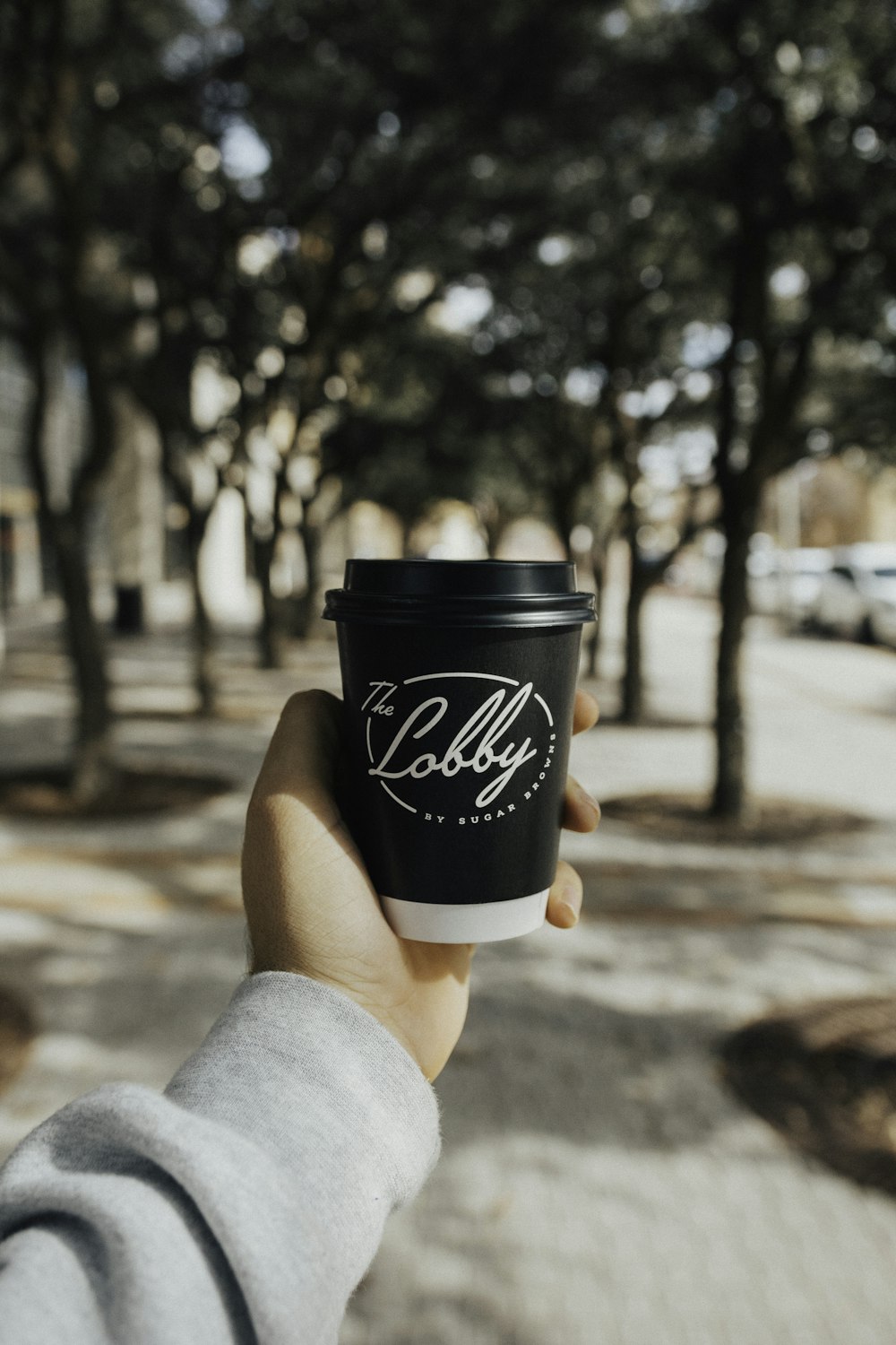 shallow focus photo of black plastic cup