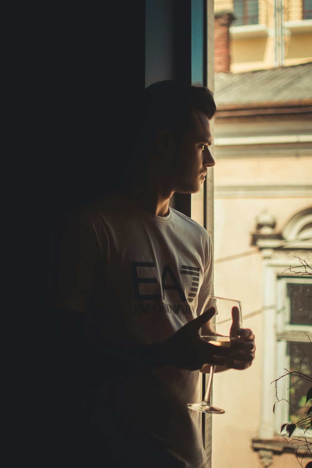 shallow focus photo of man in white crew-neck shirt