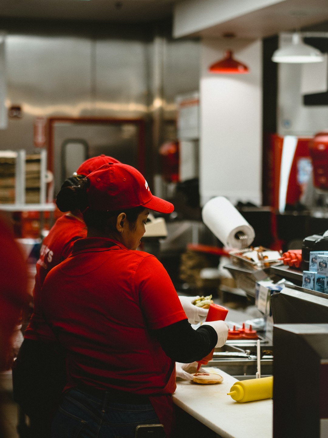 woman in red cap and shirt preparing food