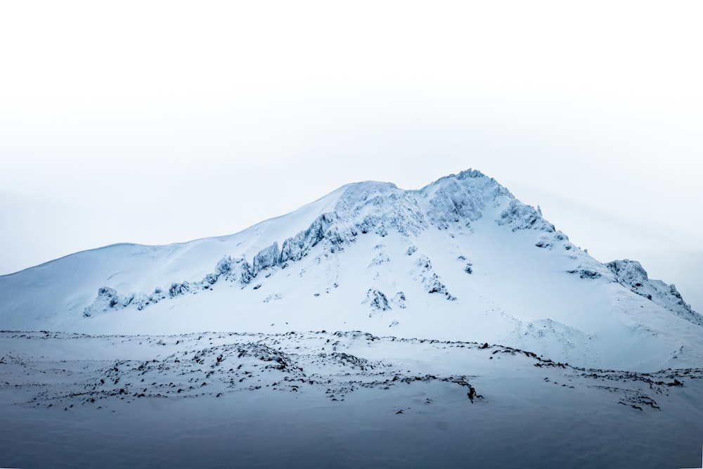 snow covered mountain during daytime