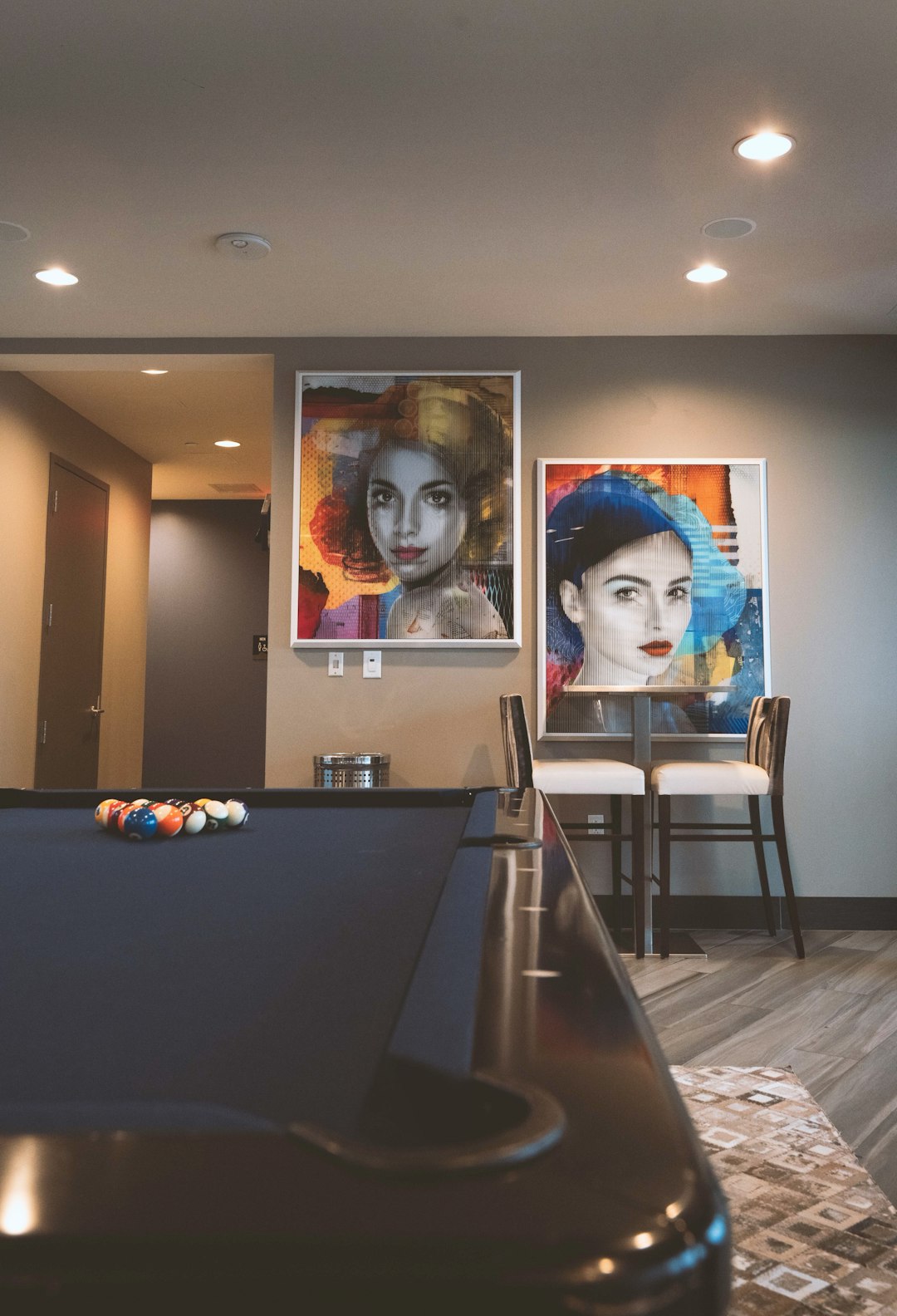 two portrait painting of women in living room