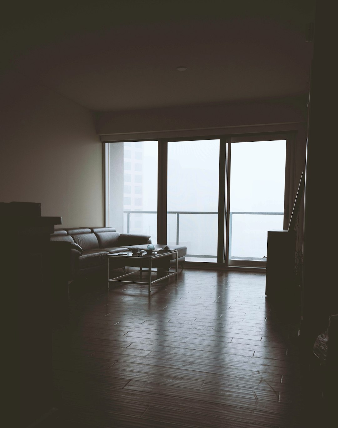 black couch near clear glass wall view