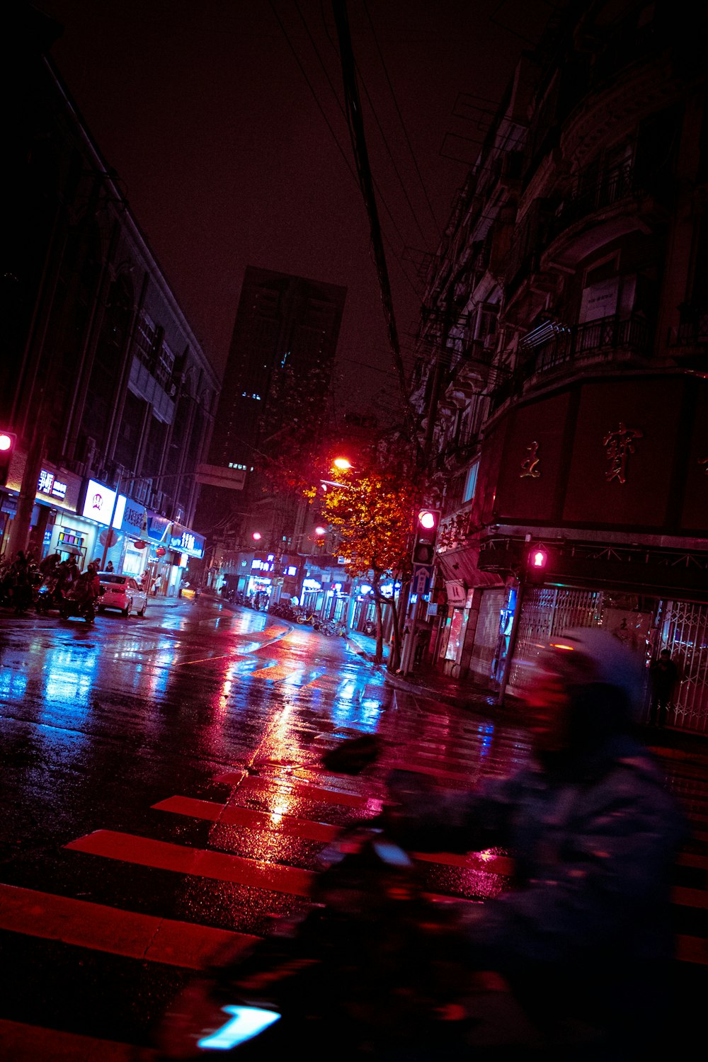 man riding motorcycle in front of lighted post lamps