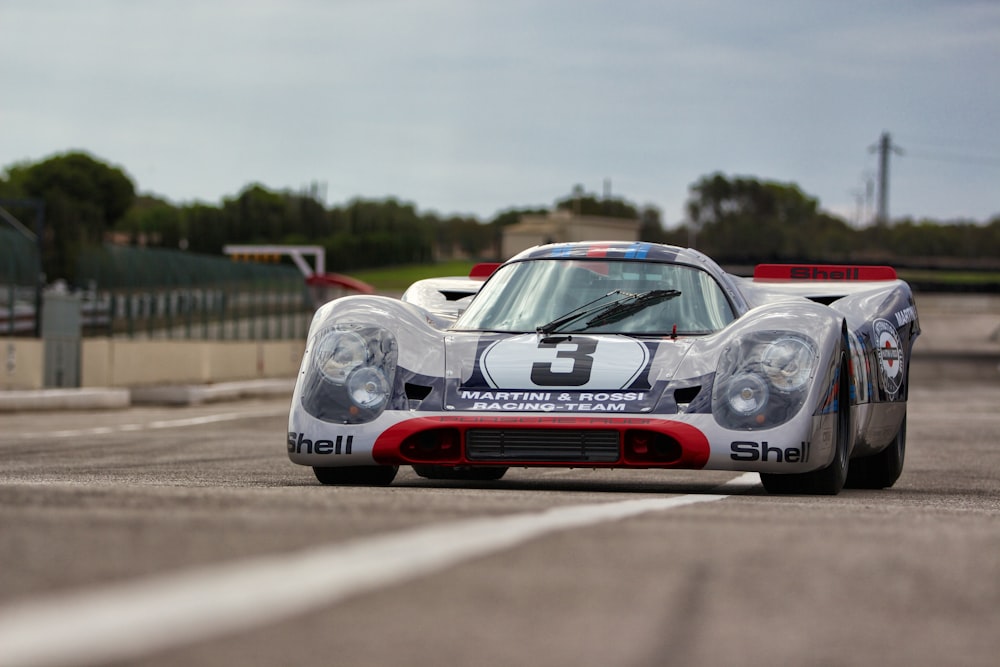 shallow focus photo of white race car