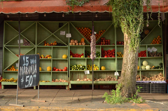 A rustic farm stand with fresh produce and a farmer sharing a smile.