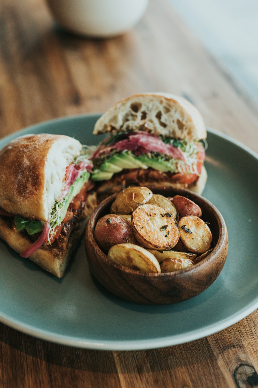 shallow focus photo of sandwich on gray ceramic plate