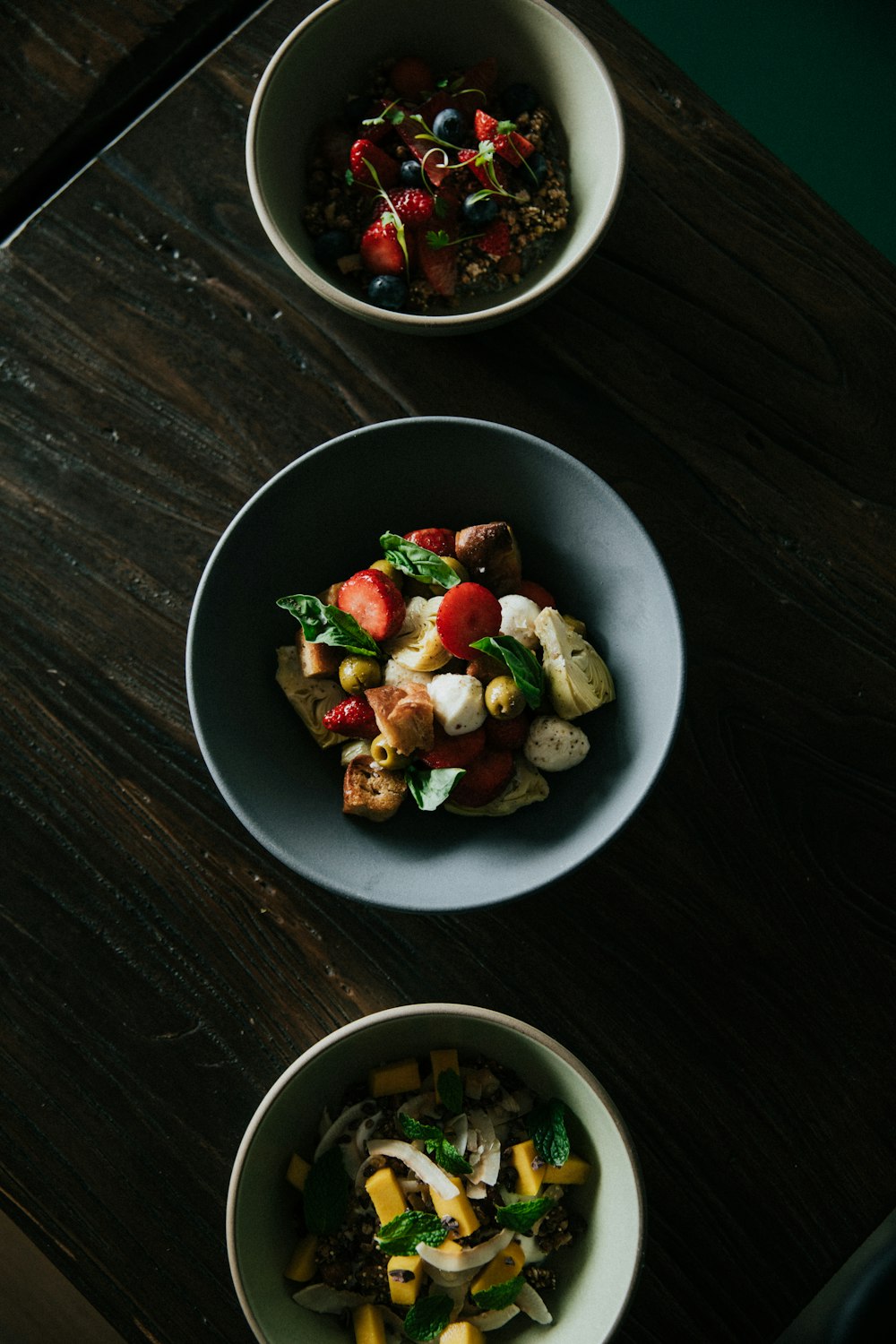 three bowls of foods