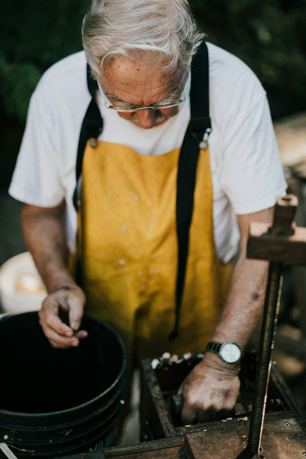 man looking downwards on bucket