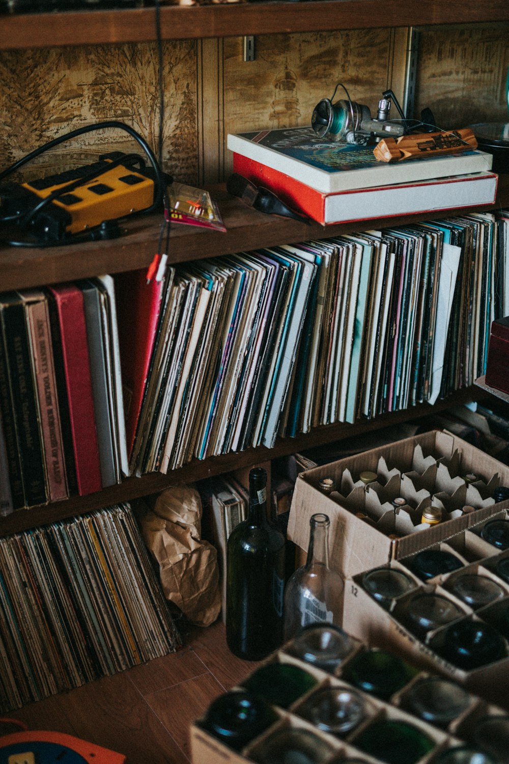 books and vinyl sleeves on shelf
