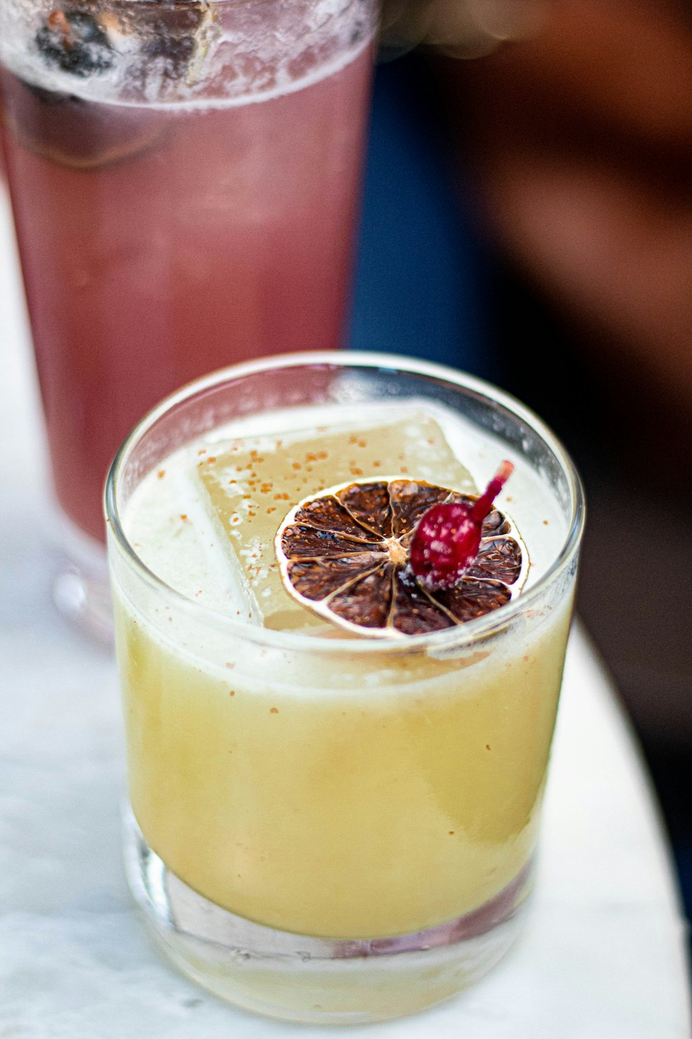 two drinks on white surface