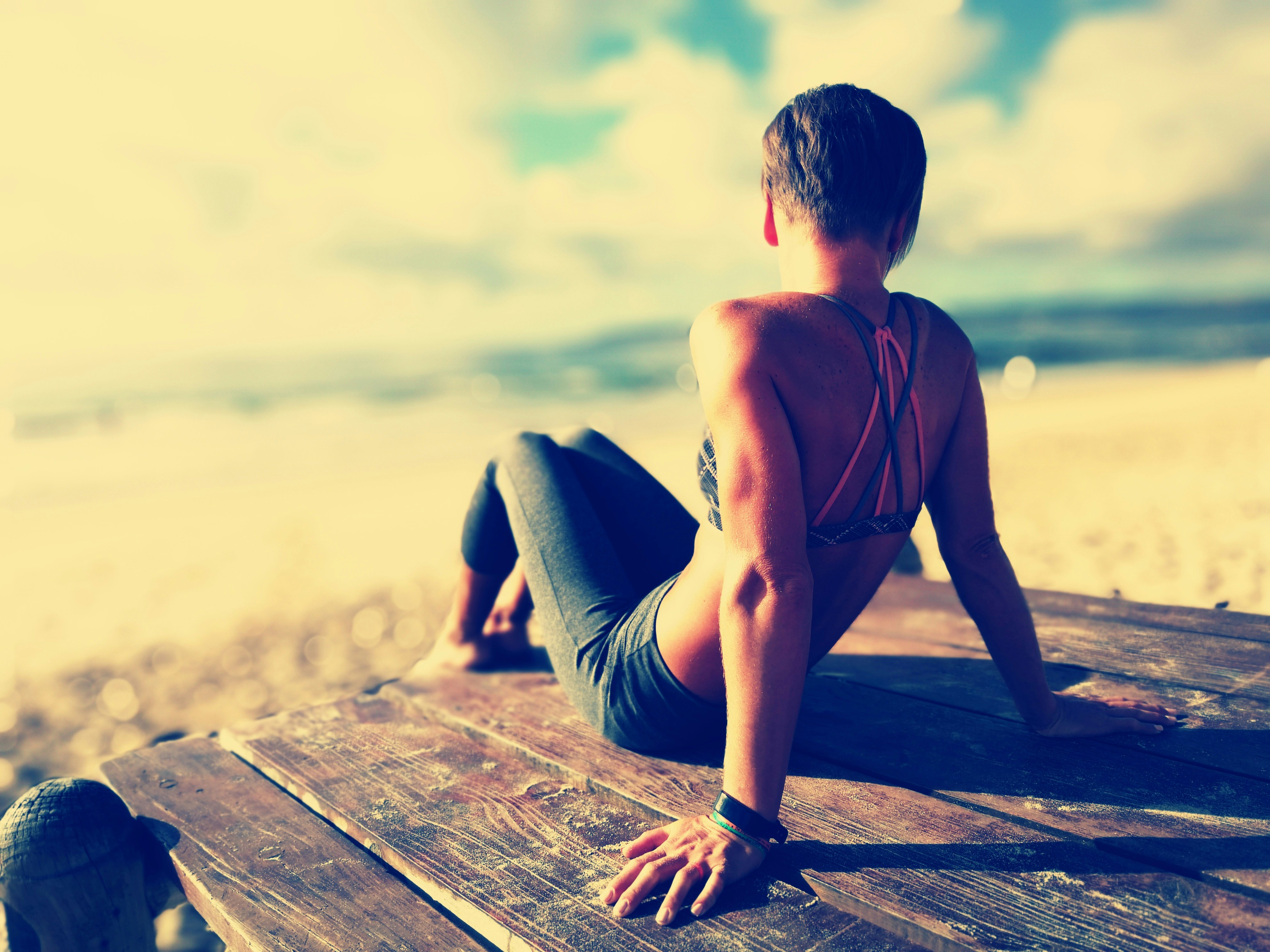 woman wearing fitted pants and sports bra
