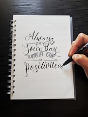 white spiral book with always text print