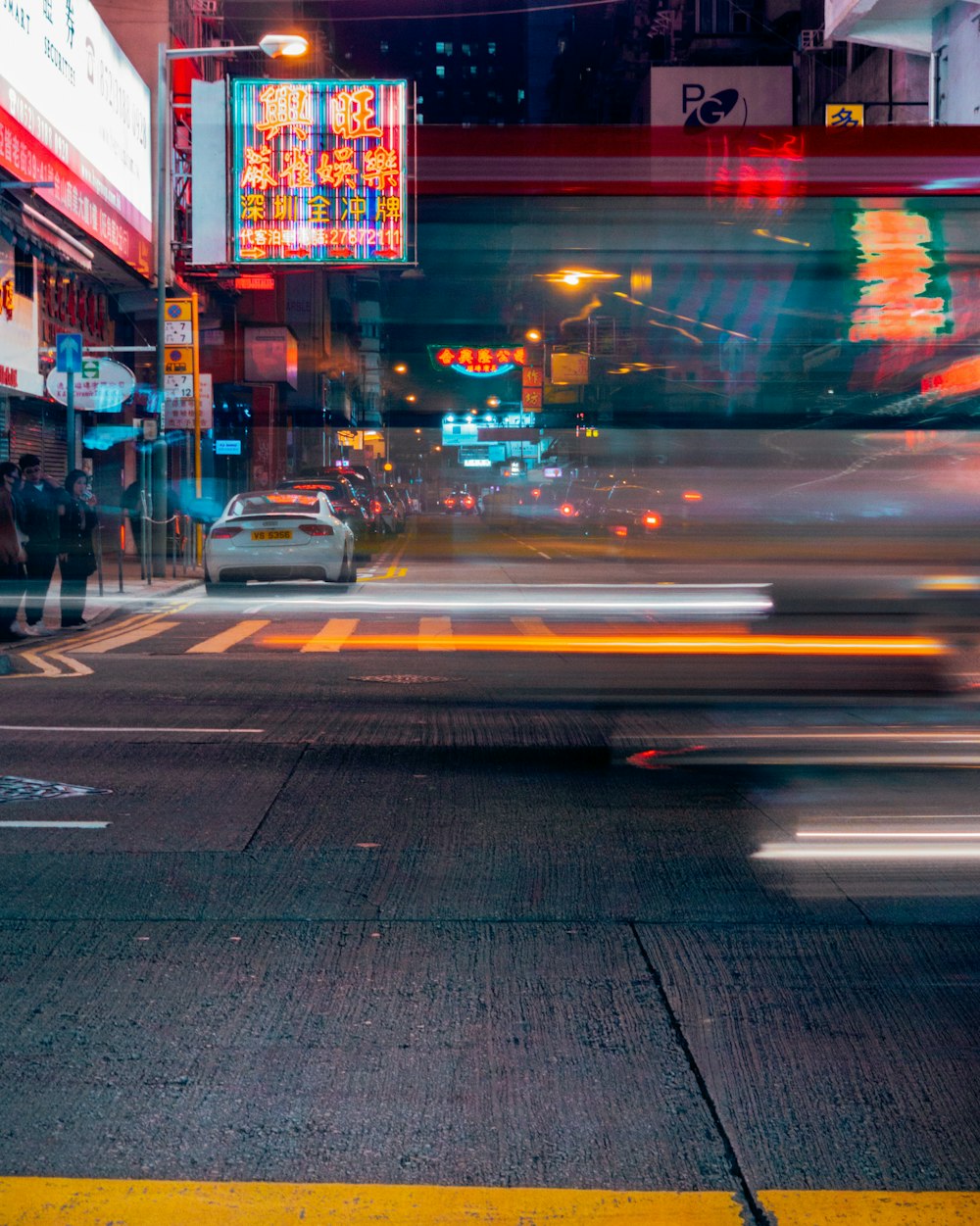 white car on roadway in timelapse photography