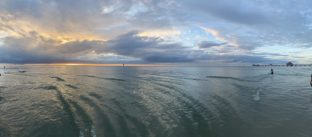 calm ocean under cloudy sky