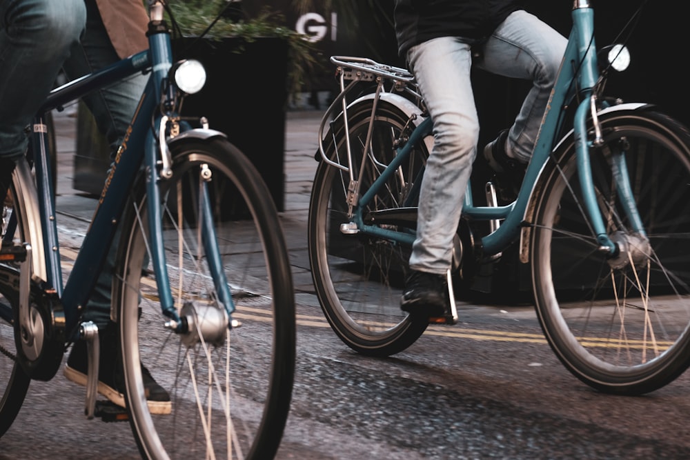 two people riding bicycles