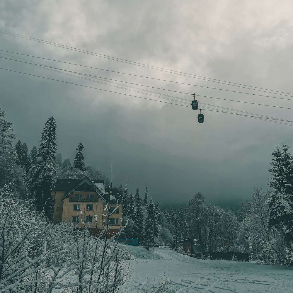 houses under cable cars under gray sky