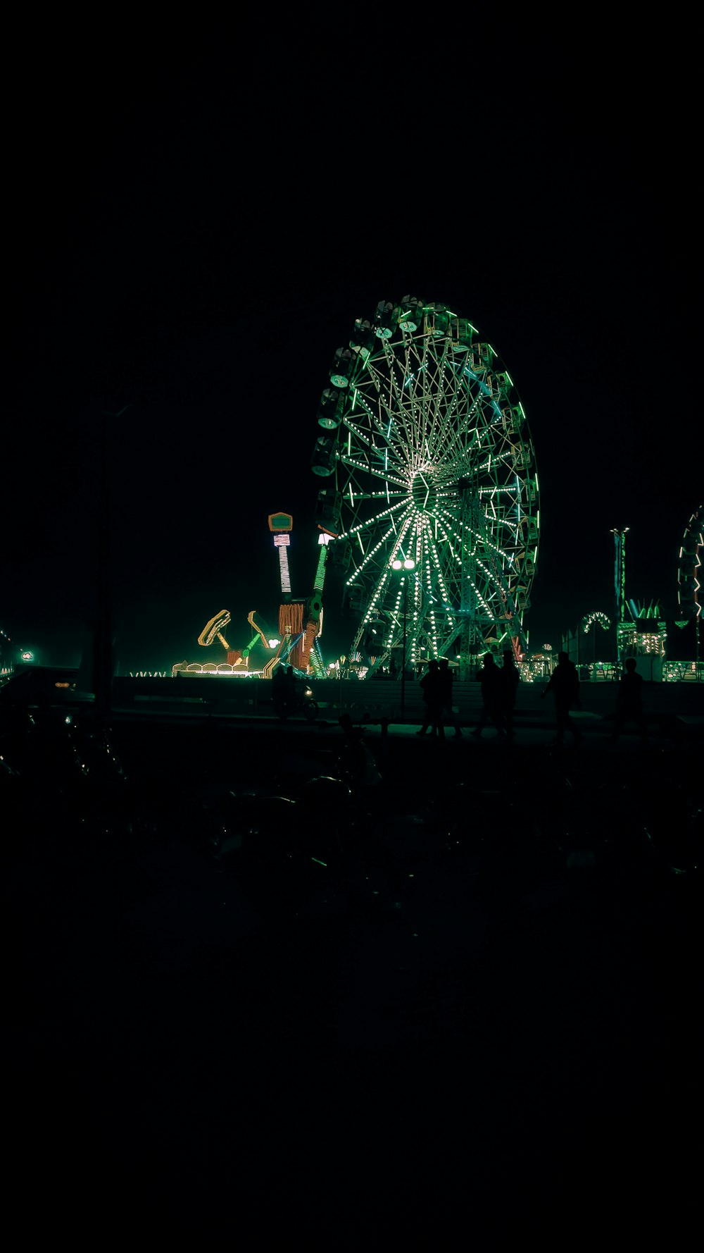 lighted Ferris wheel at night