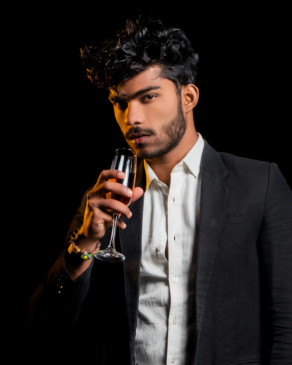 man about to drink from wineglass