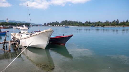 boats docked during day in Aceh Indonesia