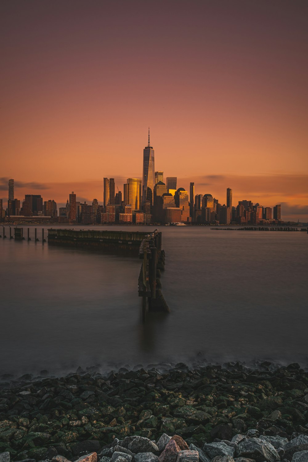 city and body of water during golden hour