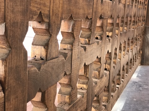 A close-up of intricately engraved wooden art pieces.